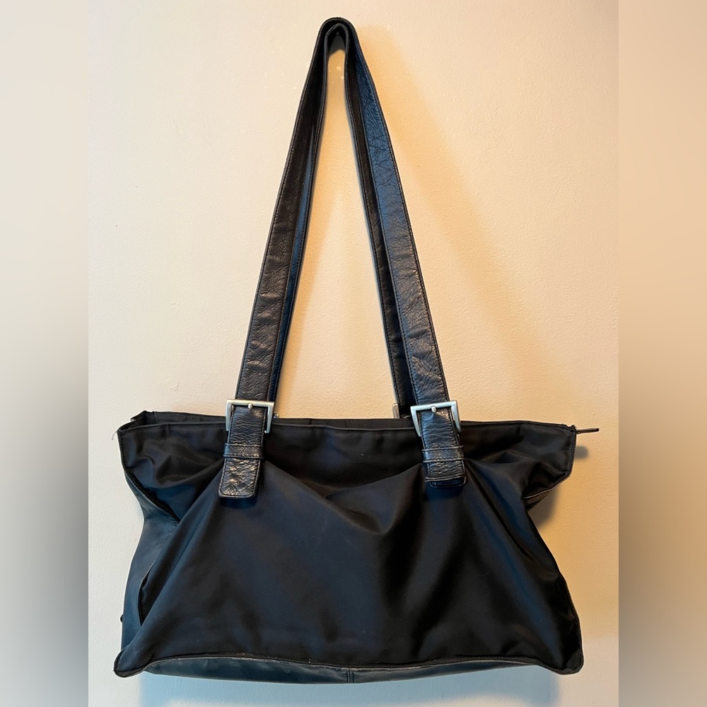 Prada nylon and black leather shoulder bag with buckle adjustable straps.